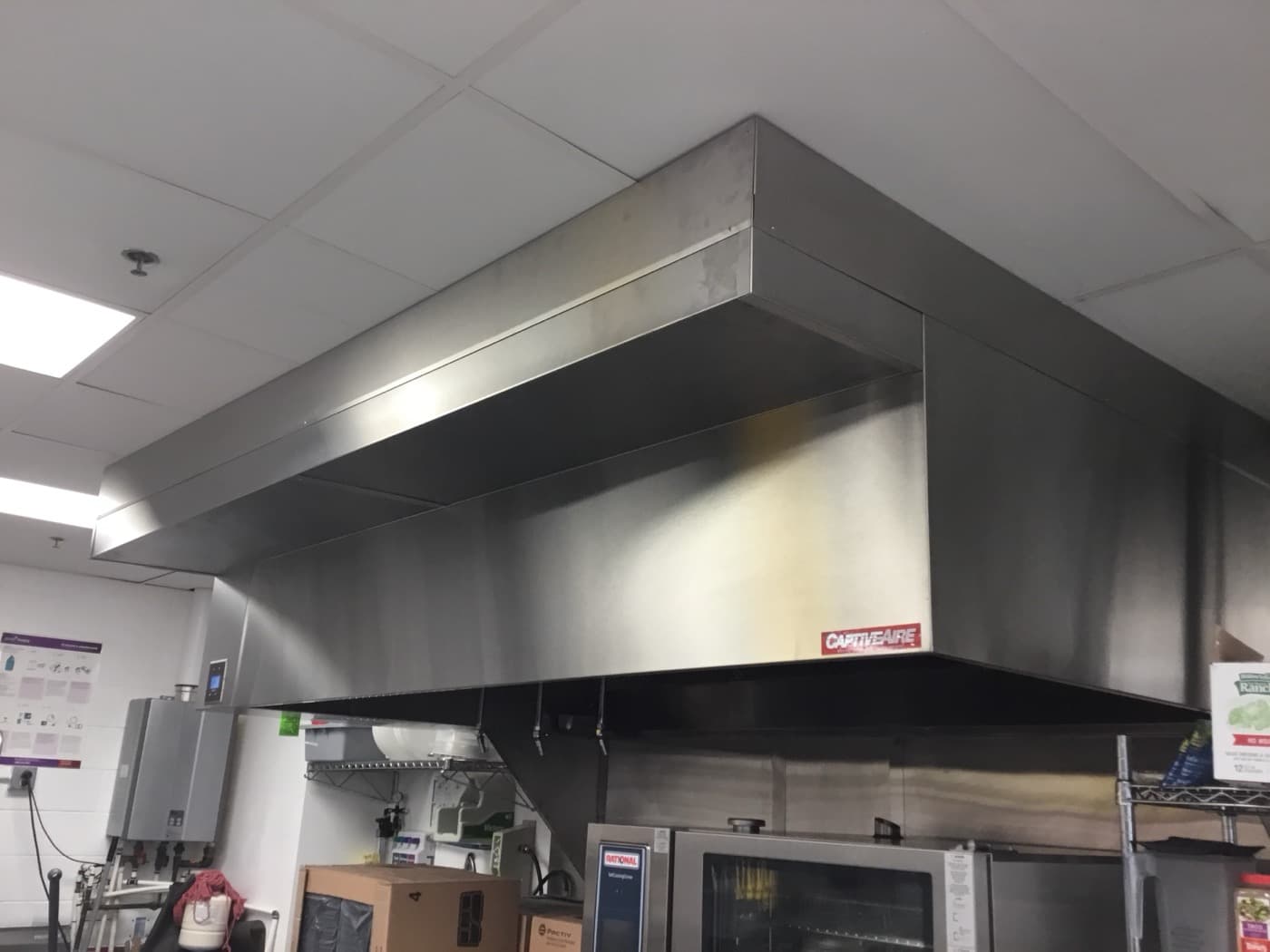 Large CaptiveAire island canopy hood installation