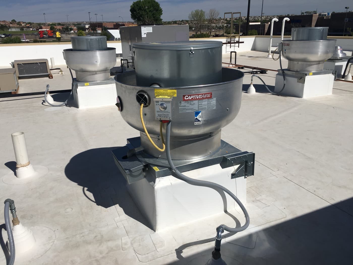 Multiple CaptiveAire rooftop exhaust fans — commercial kitchen ventilation